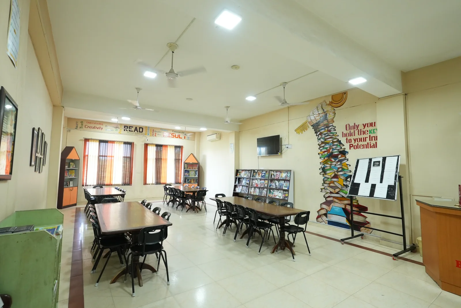 Library study tables and book mural